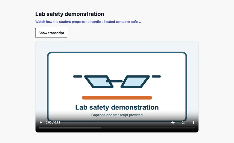 The title "Lab safety demonstration" and the description "Watch how the student prepares to handle a heated container safely." above a "Show transcript" button and a paused 12-second video whose first frame shows safety goggles and the words "Captions and transcript provided".